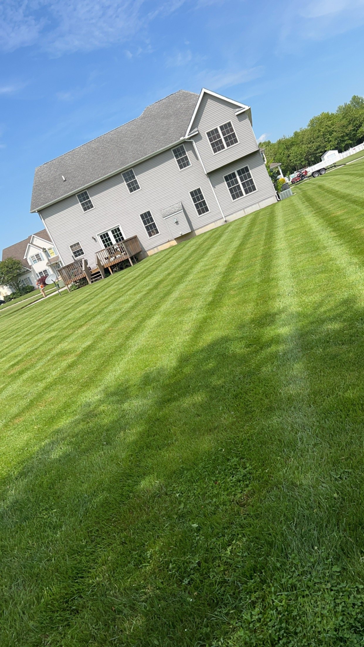 Large striped lawn maintained by Brian's Lawncare